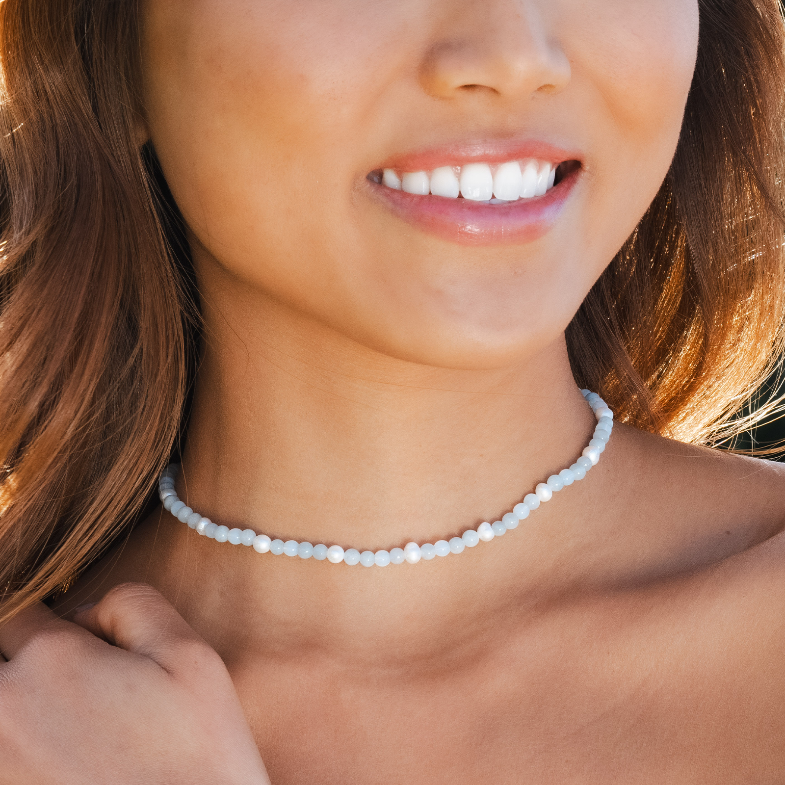 Light blue and white 4mm stone necklace with a coconut button clasp